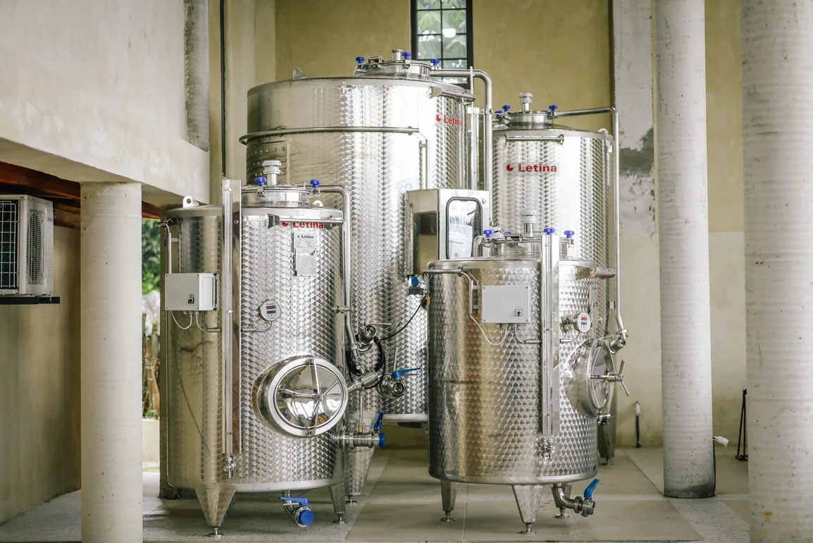 Stainless steel fermentation tanks in the Lekura cellar
